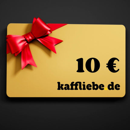 kaffliebe.de 10 € Gutschein in der Farbe Gold mit einer roten Schleife auf einem schwarzen Hintergrund.